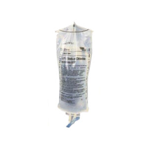 A bag of saline hanging in front of a white background